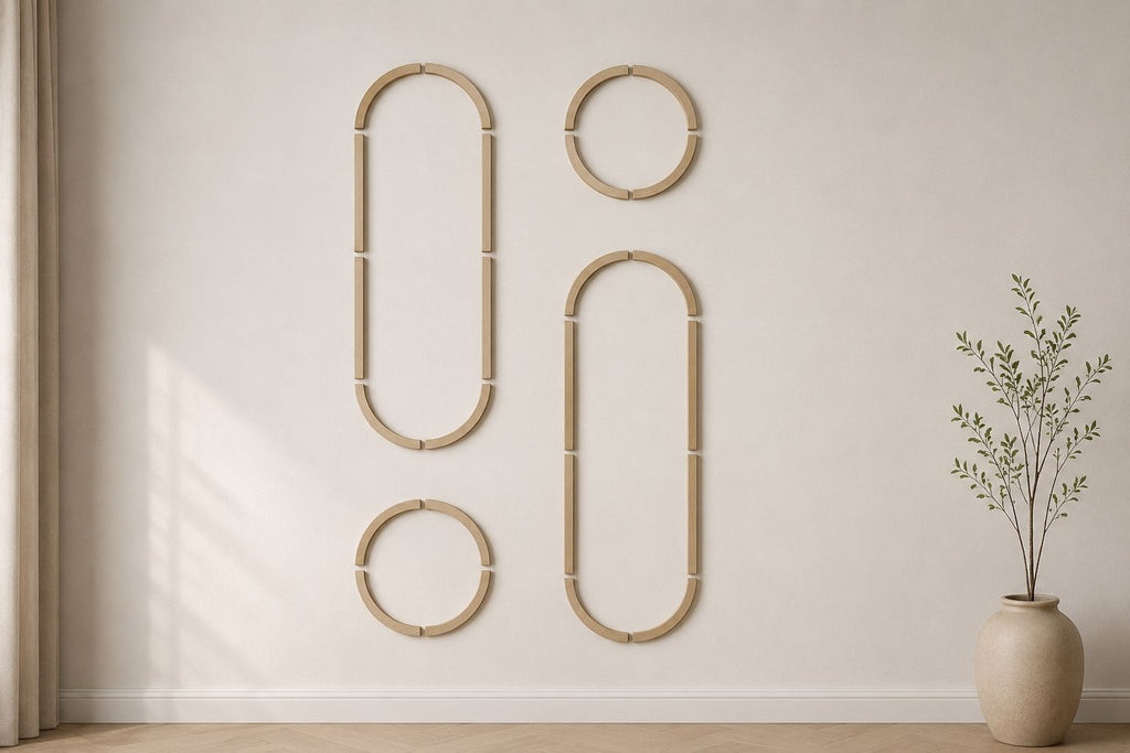 Option 2 layout of the arched wall molding kit featuring two long vertical oval MDF panels and two circular trim frames mounted on a minimalist neutral living room wall next to a vase.