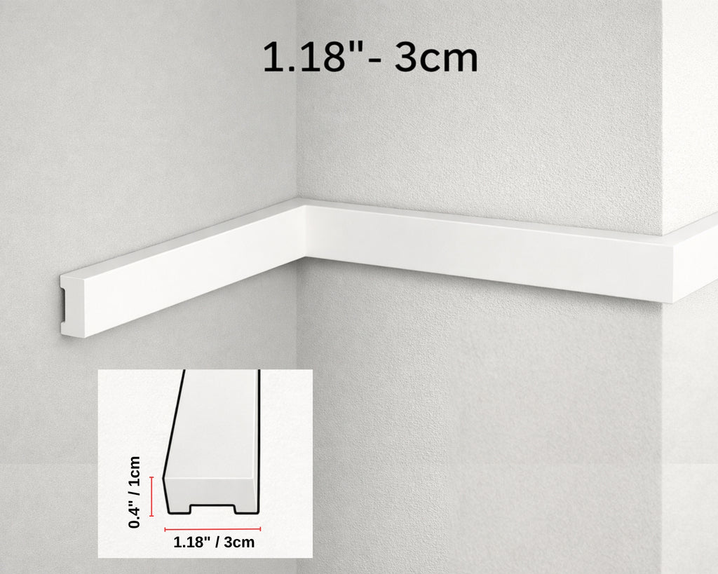White crown molding on a gray wall with measurements indicated.