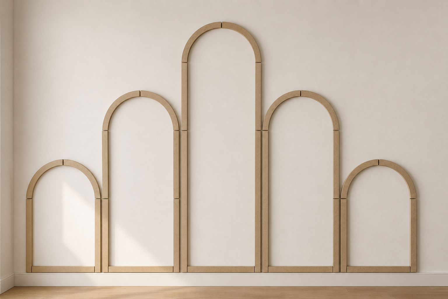 Five arched wall molding frames arranged symmetrically on a wall demonstrating the installation layout before painting.