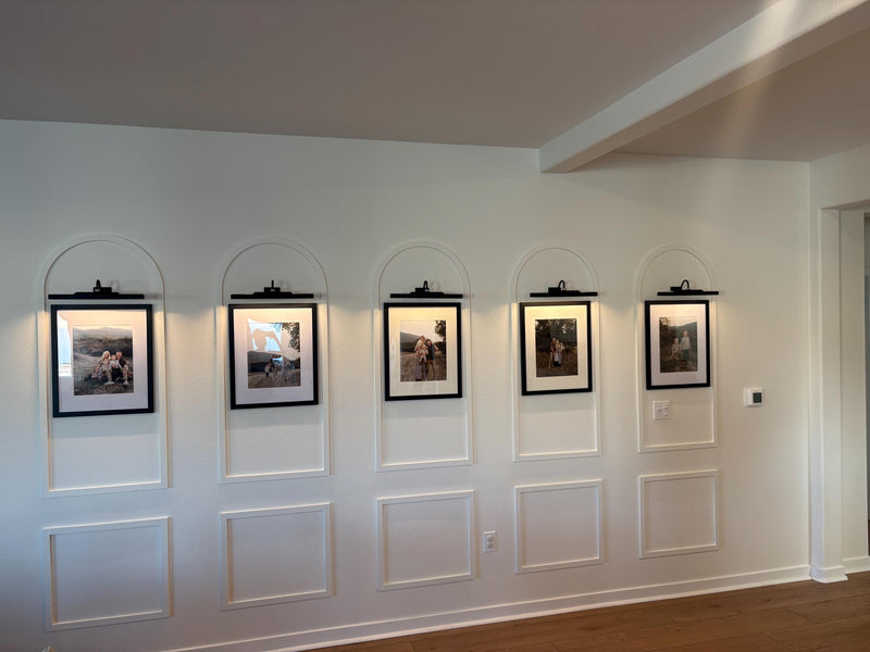 real home accent wall created with DIY arched MDF wall molding trim kit-Five framed pictures on a wall with decorative arches