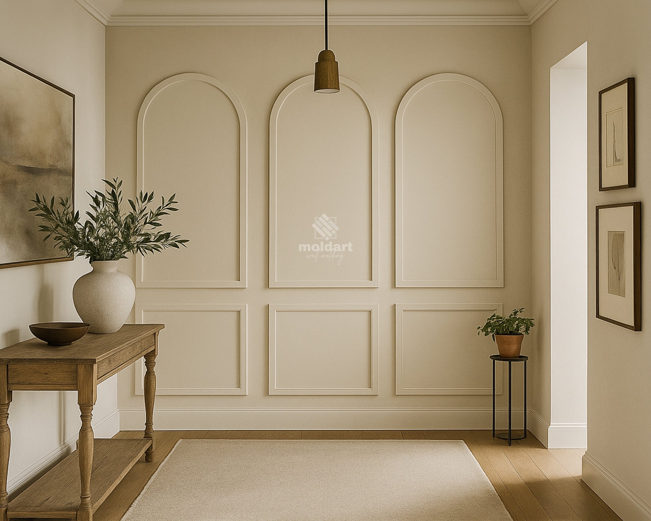 arched decorative wall panel molding design- Neatly decorated room with a wooden table, vase with plants, and framed pictures.