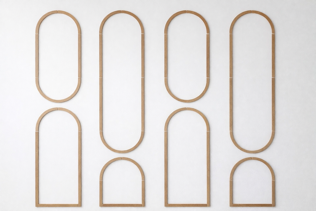 Pre-cut MDF arched wall molding kit pieces arranged for easy DIY wall panel installation