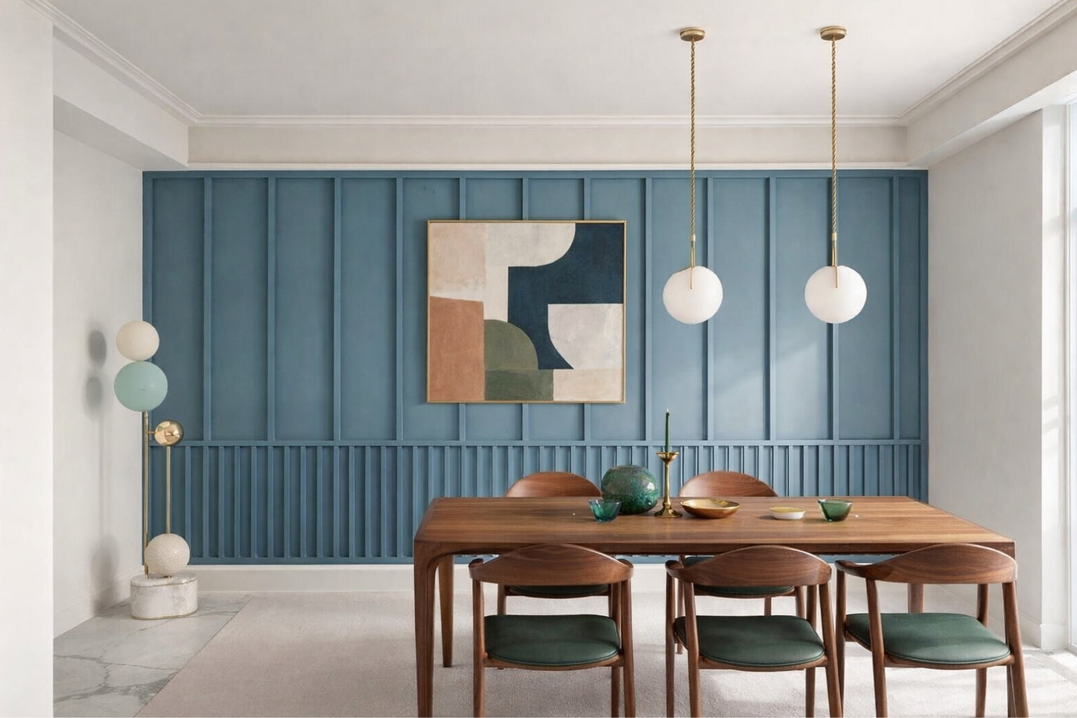 Elegant dining room with contemporary wall molding panels- with wooden table and chairs against a blue paneled wall with abstract art.
