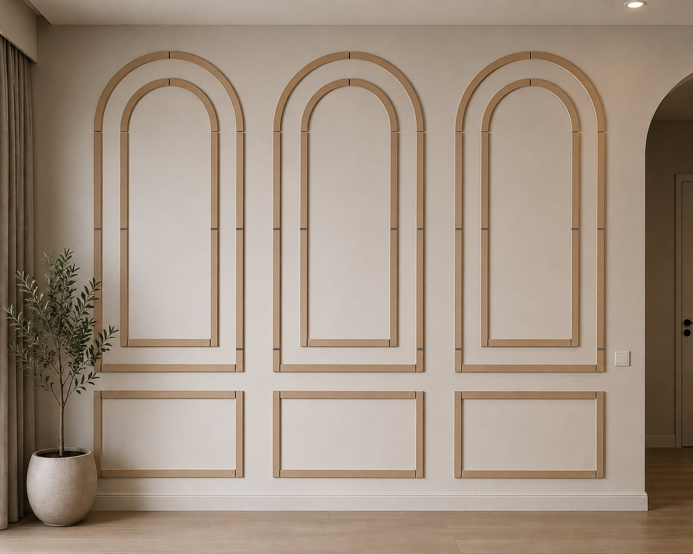 Decorative wall paneling with arch-shaped frames on a neutral wall.