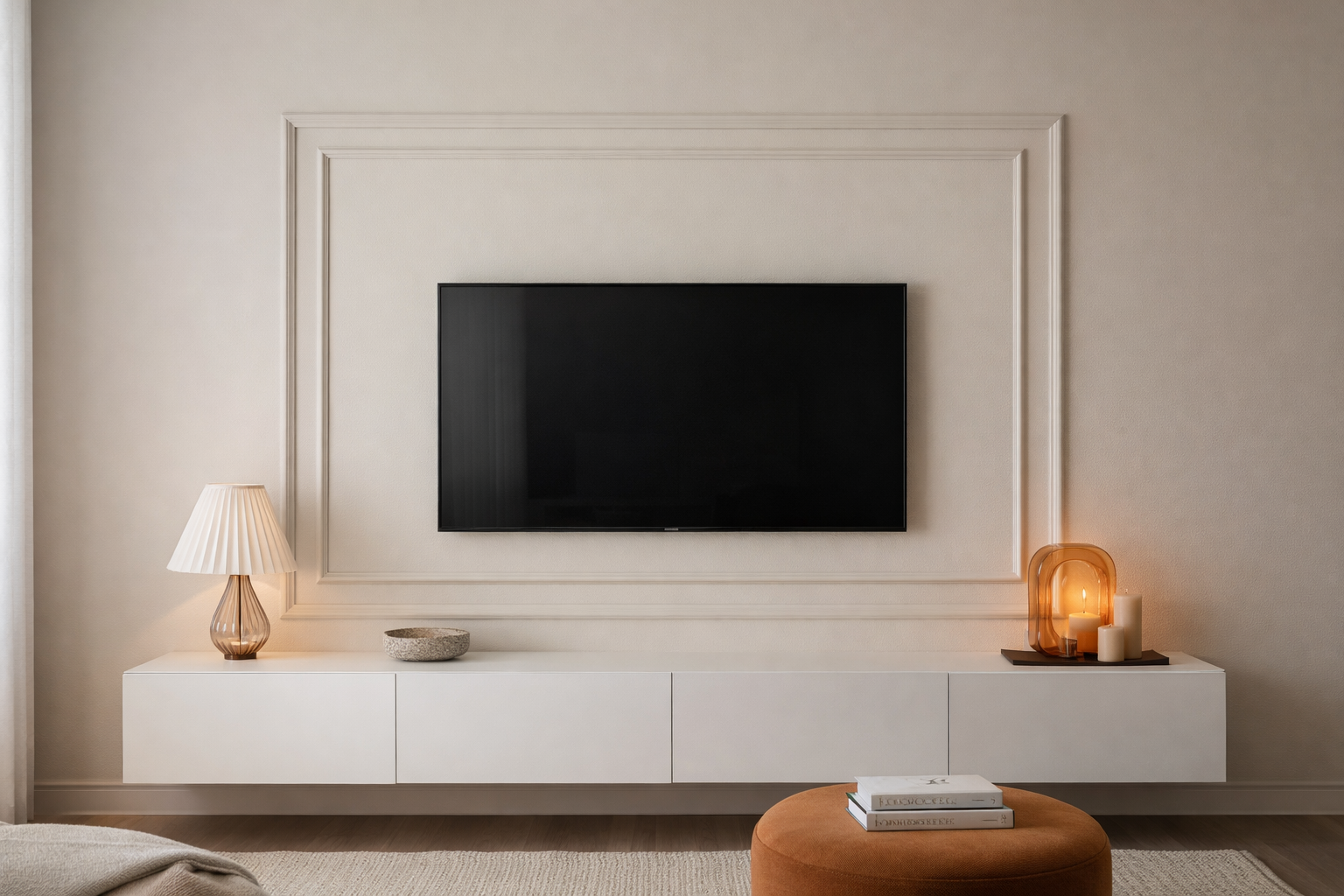 Modern living room with a television mounted on a wall surrounded by decorative wall trim.